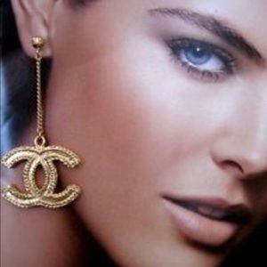 Gold Chanel drop earrings.